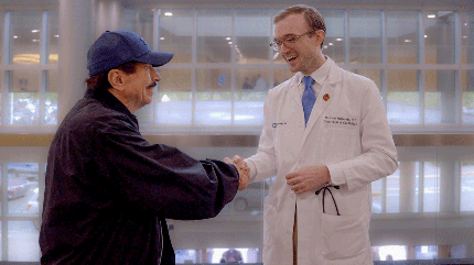 Patient, John Petri, talking with Cleveland Clinic Florida cardiologist, Dr. Malcom McDonald.
