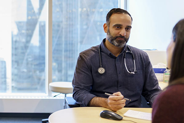 Concierge Medicine - Doctor talking with a patient | Cleveland Clinic